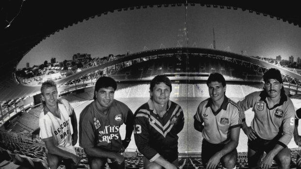 The players to play the new sports ground this year, representing their teams. From left, John Kosmina, Sydney Olympic, Soccer; Mario Fenech, South Sydney Rugby League; Wayne Pearce, Australia, Rugby League; Charlie Yankos, Australia Socceroos; Les Davidson, NSW Rugby League and Garry Worth, Eastern Suburbs Rugby League, January 07, 1988.