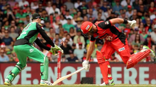 Dan Christian of the Renegades in action as Peter Handscomb of the Stars takes the bails off.