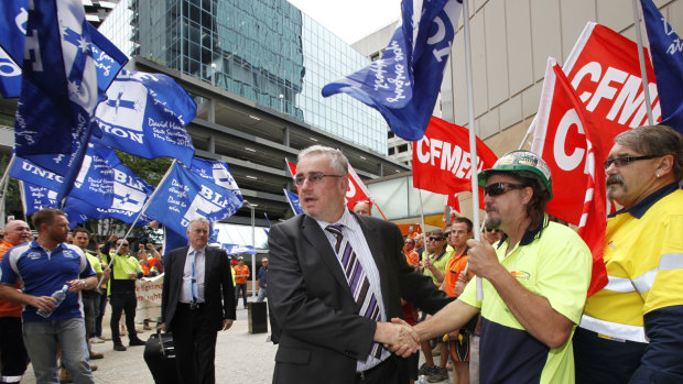 Bob Carnegie greets union supporters at the Brisbane Federal Court in 2013, where he was attending a hearing over his role in a picket line.