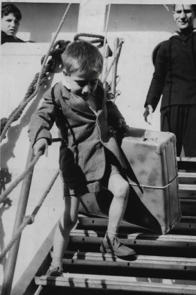 Six-year-old Bruno Cielli from Italy carries his suitcase ashore at North Wharf in Docklands in 1965.