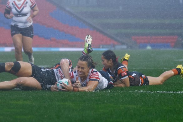 Roosters captain Isabelle Kelly scores a try in the first half.