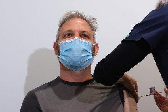 Chief Health Officer Brett Sutton receives the vaccine at the Royal Exhibition Building.