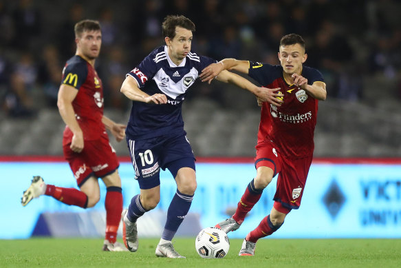 Victory’s Robbie Kruse takes on Louis D’Arrigo.