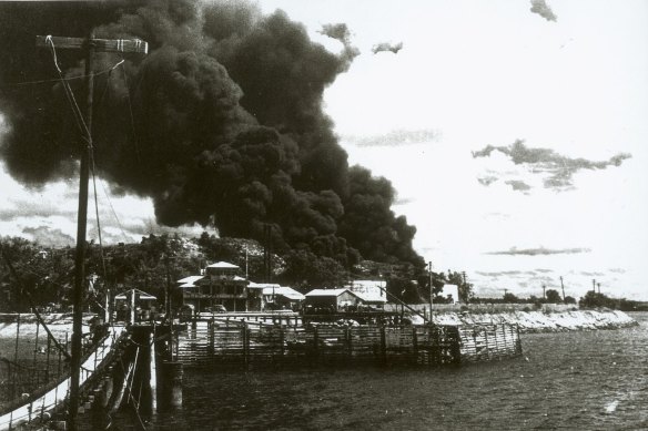 Burning oil tanks following Japanese raid on Darwin, early in 1942.