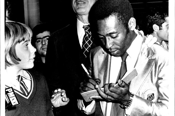 Pelé signs an autograph after arriving in Sydney in June 1972.