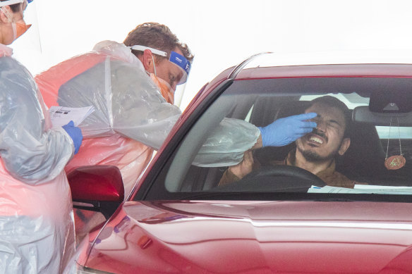 A worker from the Australian Lamb Co abattoir is tested for COVID-19 in Colac.