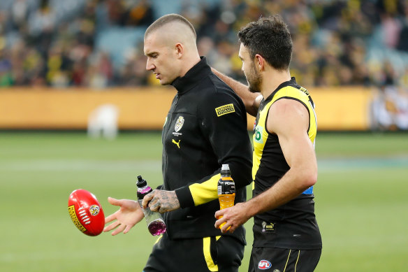 Dustin Martin (left) has had a hamstring setback.