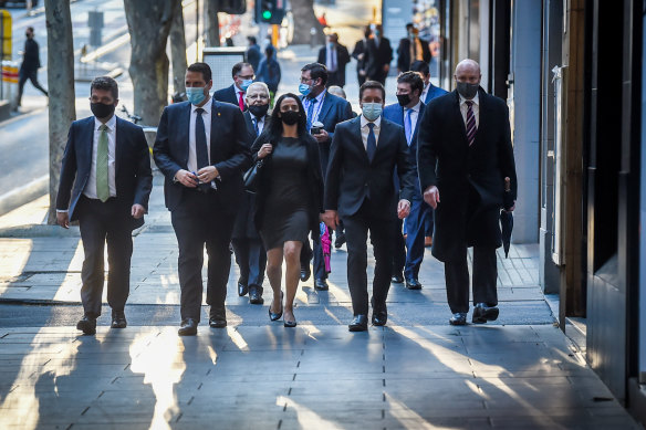 Matthew Guy (second from right) walks to the Liberal party room on Tuesday, flanked by his supporters, to topple Michael O’Brien. 
