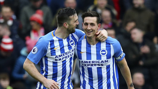 Brighton's Lewis Dunk, right, after scoring his side's first goal against Arsenal at the AMEX Stadium on Sunday.