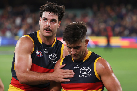 Crows Darcy Fogarty and Josh Rachele (right) after the loss to Essendon.