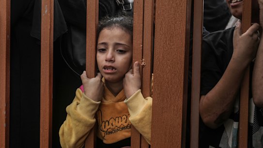 People mourn as they collect the bodies of Palestinians killed in Israeli raids in Khan Yunis, Gaza.