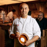 Chef Benny Lam pictured at his Central restaurant with the claypot he uses to cook rice at home.