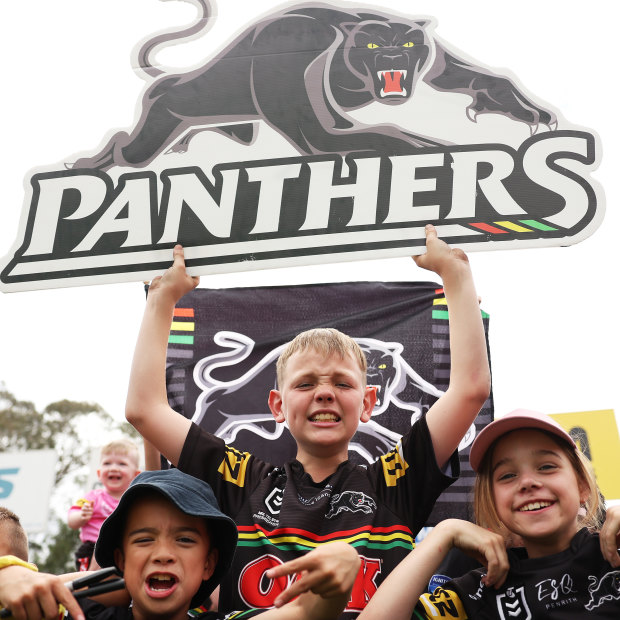 Young Panthers fans watch their idols at a grand final training session this week.