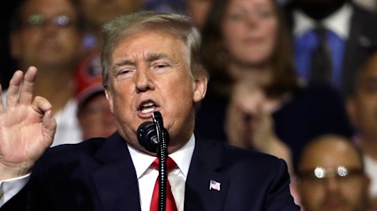 'We are Q': QAnon conspiracy cult leaps from web to Trump's tour