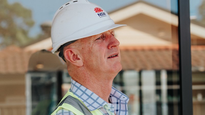 Building commissioner attends completion ceremony for developer under disciplinary investigation