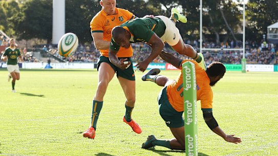 Makazole Mapimpi of the Springboks is tackled by Marika Koroibete.