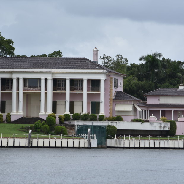 The view of the pink mansion from New Farm Park, on the opposite side of the Brisbane River.