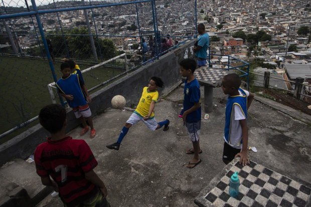 Boys playing soccer in a favela in Rio de Janeiro