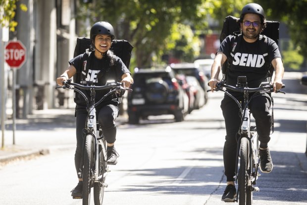 Delivery riders Mariella Bagang and Chintan Mewada work for Send in Melbourne. Unlike gig economy riders, they enjoy traditional employment.