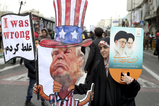 An Iranian woman holds an effigy of US President Donald Trump during a rally.