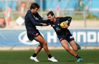 Carlton’s Brodie Kemp is tackled by teammate Caleb Marchbank (right) at training earlier in the year