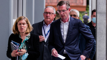 Delayed response: Perrottet with his health minister Brad Hazzard and Chief Health Officer Kerry Chant at Royal North Shore Hospital on Wednesday. 