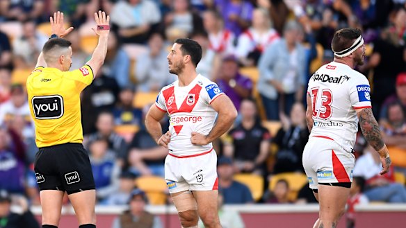 Josh McGuire of the Dragons is sin-binned for a high shot on Justin Olam.