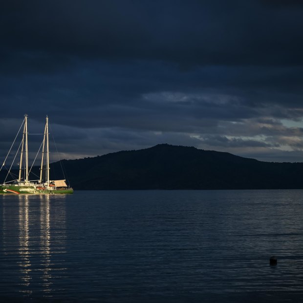 The Greenpeace Rainbow Warrior is anchored off the coastline near Kioa island.