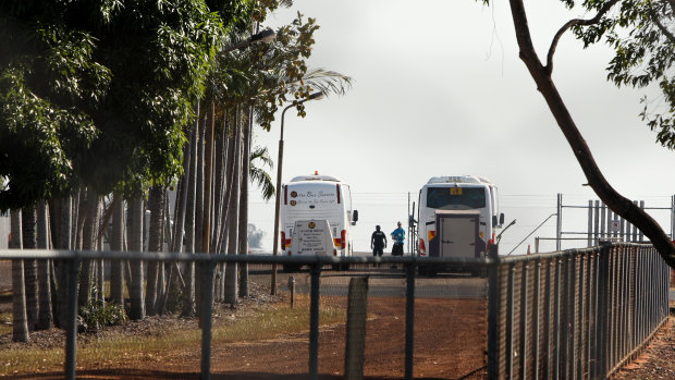 Buses ferry passengers from a flight from India to Howard Springs Quarantine Facility.