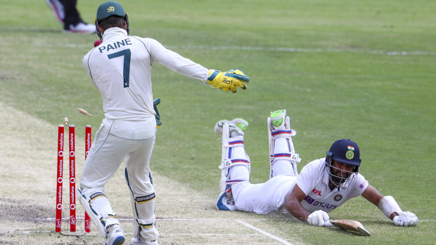 India’s Cheteshwar Pujara dives to make his ground as Tim Paine takes the bails off during play on the final day of the fourth Test between India and Australia at the Gabba in January this year.