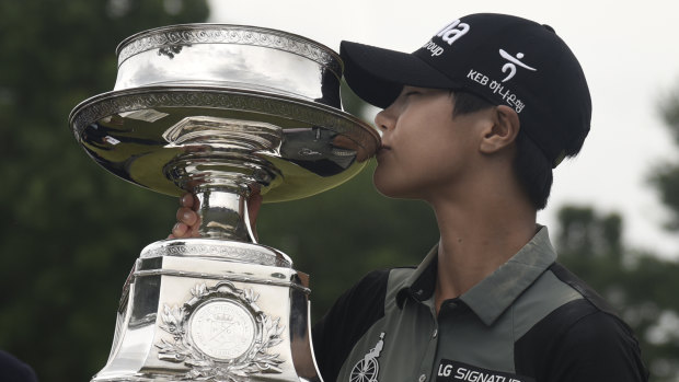 Triumph: The South Korean kisses the trophy she won on the second playoff hole.