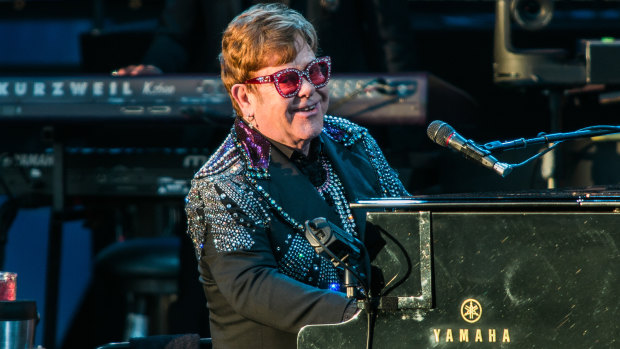 Elton John entertains the crowd with songs from his extensive back catalogue.