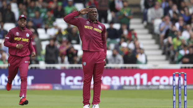 West Indies' Sheldon Cottrell celebrates taking a Pakistan wicket.