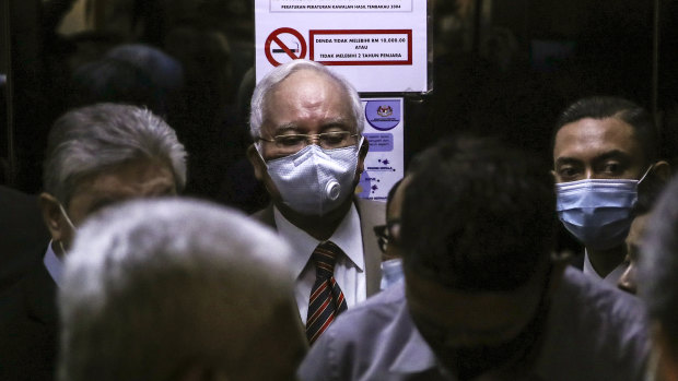 Malaysia's former prime minister Najib Razak, centre, arrives at the Kuala Lumpur Courts Complex on Tuesday.