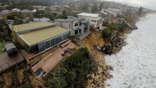 Coastal erosion is seen from the air over Ocean View Drive at Wamberal on Saturday. 