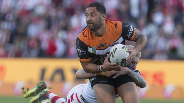 Everything old is new again: Benji Marshall looks for support in the tackle during a typically composed performance for the Tigers.