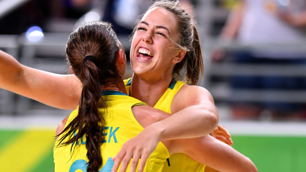 Jenna O'Hea and Alice Kunek celebrate the Opals' gold medal win at the Gold Coast Commonwealth Games.