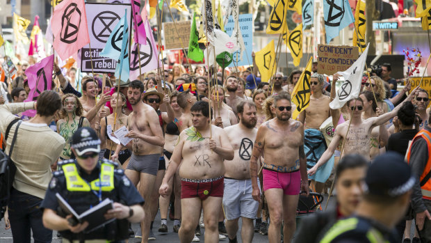 Spring rebellion: Activists stripped to their underwear and marched through the city on Saturday.