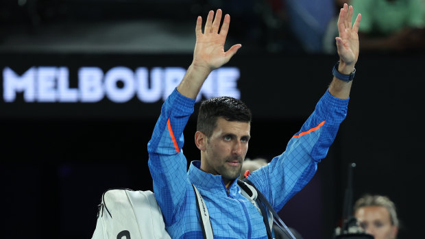 Novak Djokovic waves to the crowd after breezing past local hope Alex de Minaur.