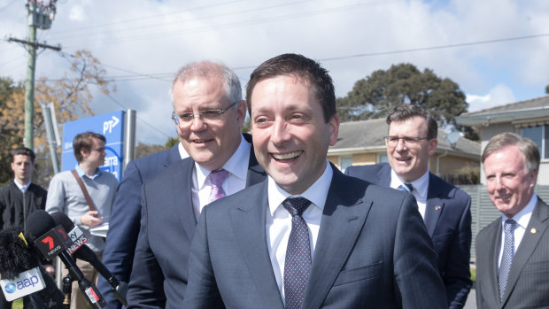 With state Opposition leader Matthew Guy at his shoulder, Mr Morrison reaffirmed the Coalition's $225 million commitment to electrify the Frankston line to Baxter.
