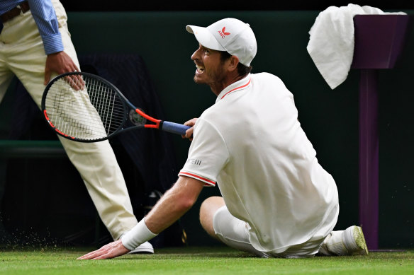 Andy Murray slips on day three at the All England club.