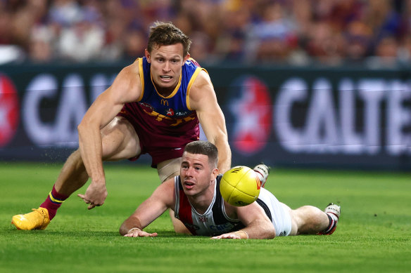 Ryan Lester of the Lions and Jack Higgins of the Saints compete for the ball.