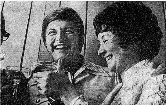 “Liberace toasts the blushing bride, Mrs L. Singer, at her airport wedding reception yesterday.”