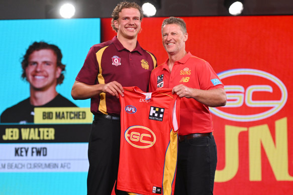 New Gold Coast coach Damien Hardwick (right) was pleased when his club landed hulking forward Jed Walter from its own academy at the draft.