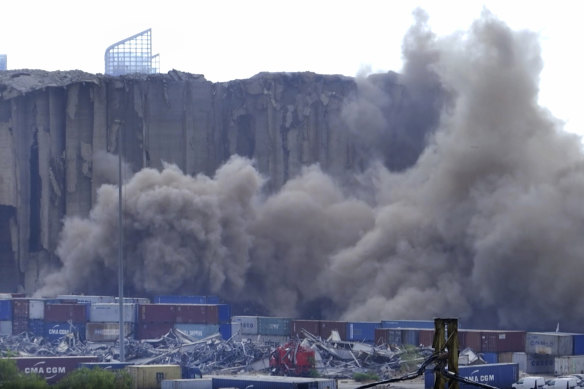 Dust rises in the port of Beirut, Lebanon, on Sunday, July 31, 2022 after a section of the city’s massive port grain silos, shredded in the 2020 explosion, collapsed.