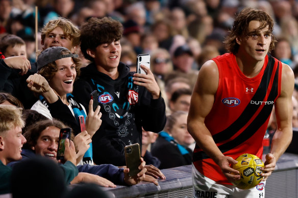 Harrison Jones receives encouragement from fans at Adelaide Oval.