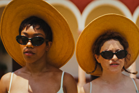 Frida (Naomi Ackie, left) and Jess (Alia Shawkat) learn the hard way that you should never accept a free holiday from a tycoon in Blink Twice.   