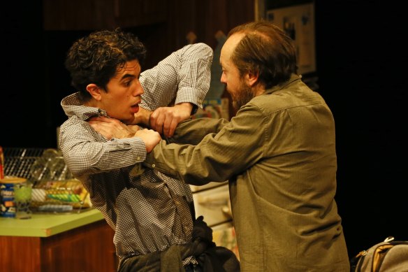 Steve Mouzakis and Karl Richmond wrestle in MTC’s The Lifespan of a Fact.
