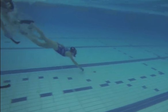 Ms Fowler, pictured playing underwater hockey, spends a lot of time in the water.
