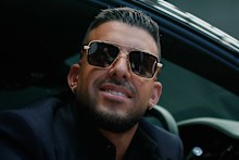 Portelli pictured in 2023. He is reportedly weighing a sale of parts of his business.